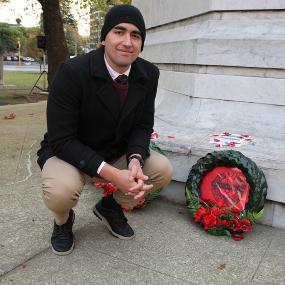Isaac-Smiler,-pauses-with-a-commemorative-wreath-the-28th-Maori-Battalion-at-the-ANZAC-Day-Dawn-Parade-in-Dunedin.-He-was-the-2021-recipient-of-the-scholarship-from-the-battalion.-New-Zealand,-April-2021