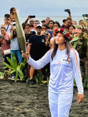 Imihia Teumere bears the Olympic Torch