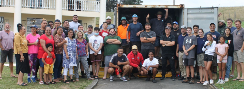 Hamilton-team-loads-a-container-headed-for-Tonga.-New-Zealand,-February-2022