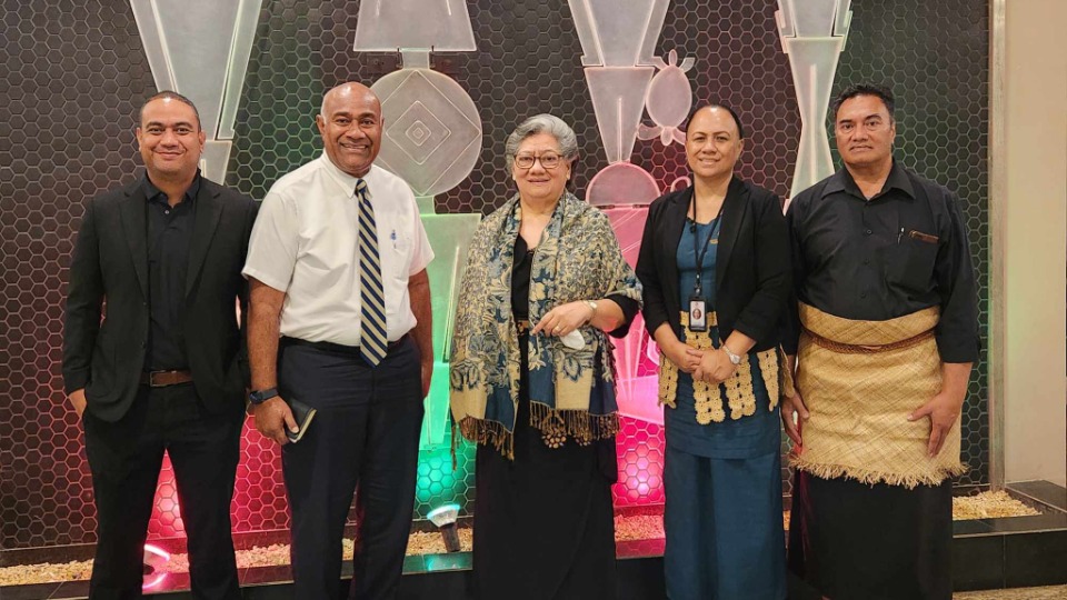 Elder Wakolo with Tongan Delegates