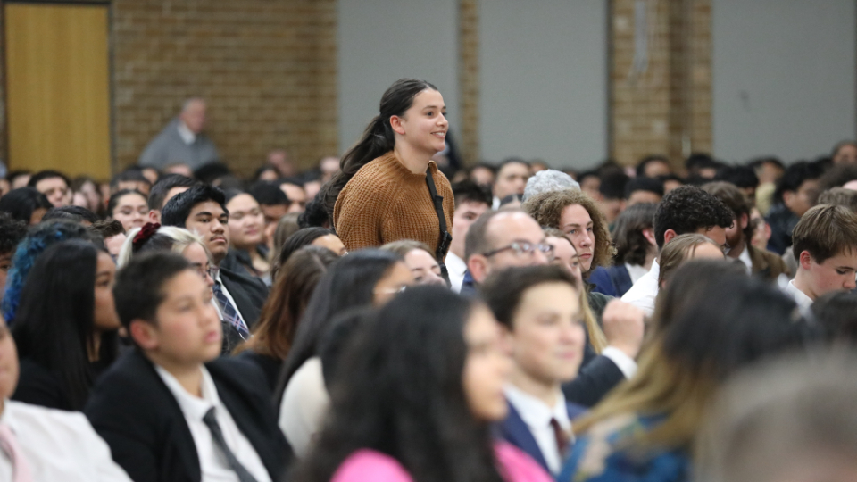 A-young-person-asks-a-question-during-a-devotional-in-Melbourne-on-19-May-2023.