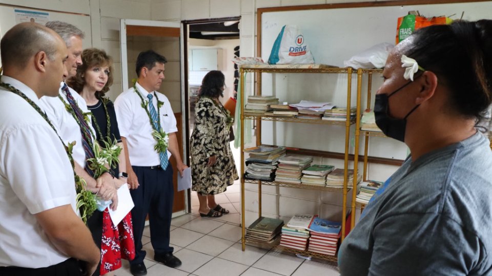 Elder-and-Sister-Nattress-being-shown-the-library-of-the-Tiai-Nui-Here-shelter-for-young-women.-French-Polynesia,-November,-2021