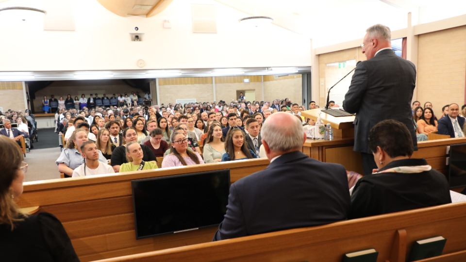 Elder Ulisses Soares speaks to young adults in Sydney, Australia. 10 March 2023.