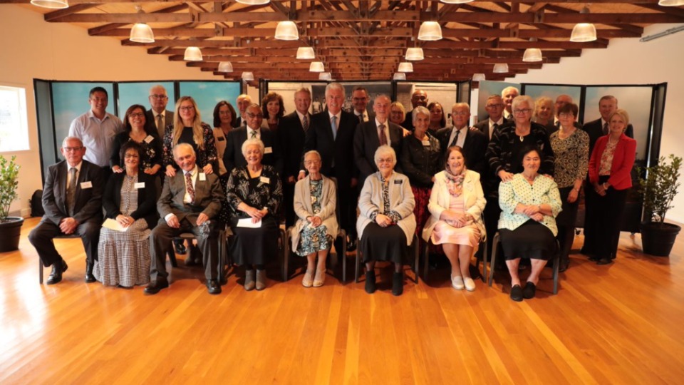 Elder Dieter F. Uchtdorf with pioneer members of The Church of Jesus Christ of Latter-day Saints in Hamilton, New Zealand on 15 October 2022.