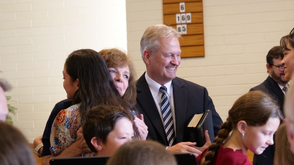 Elder-and-Sister-Nattress-greet-members-of-the-Church-after-a-sacrament-meeting-in-Auckland,-New-Zealand.-12-March-2023.