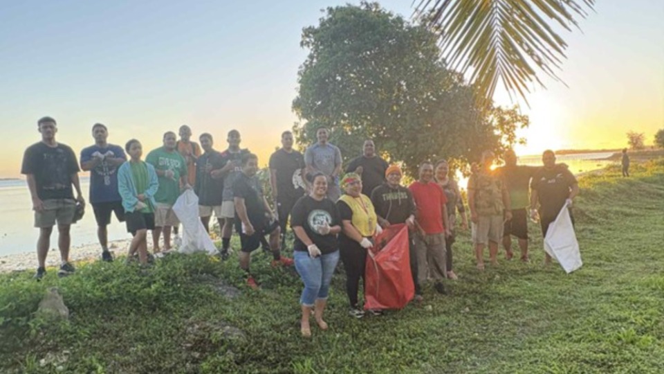 Tongan group cleaning beaches.