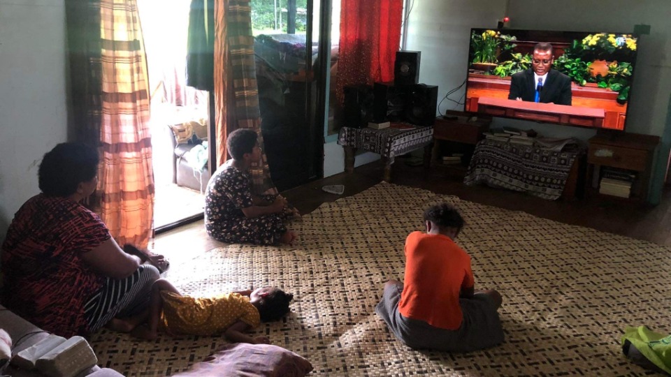 Eseta-Rebuka-and-her-children-watch-General-Conference-at-home-in-Fiji-on-16-April-2023.-