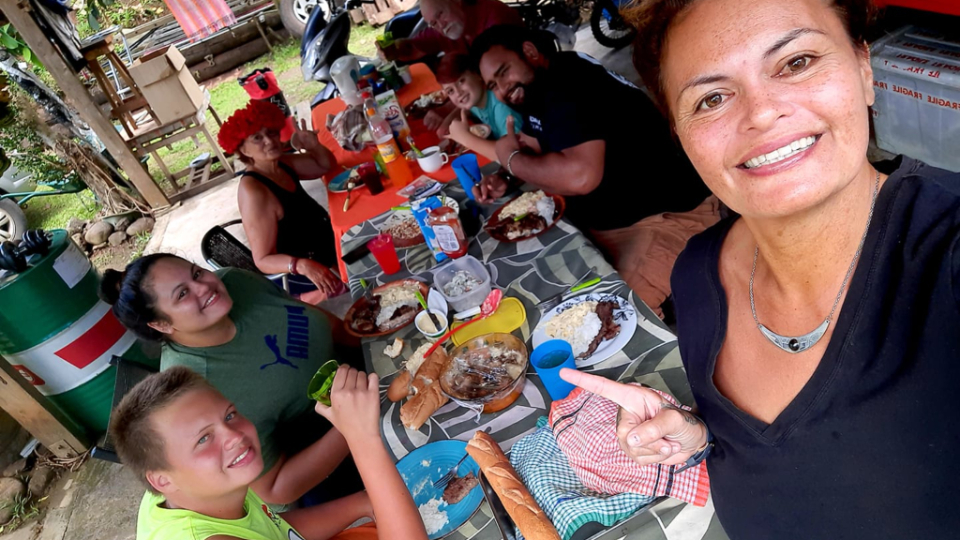 Vairea-Terai-Fabre-from-Moorea-Island-eating-with-her-family-after-fasting-for-the-first-time.--French-Polynesia,-September-2021
