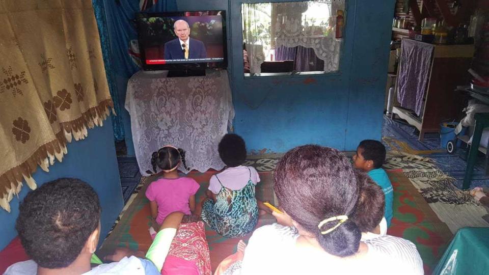 A family in Fiji watching General Conference.