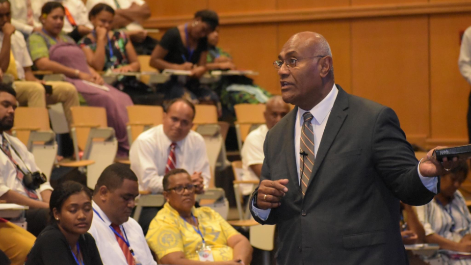 Elder-Taniela-B.-Wakolo,-member-of-the-Pacific-Area-Presidency,-speaks-at-Fiji-YSA-Conference-2023.