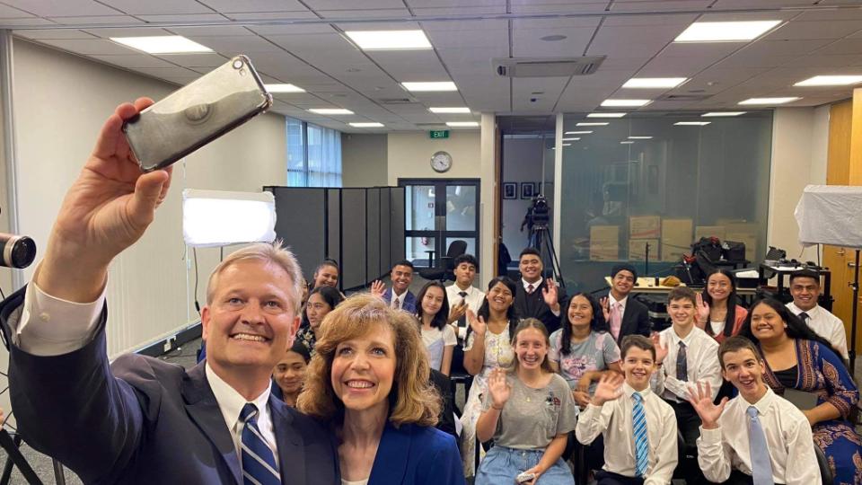 Elder and Sister Nattress, and some young friends, pose for a selfie after a 