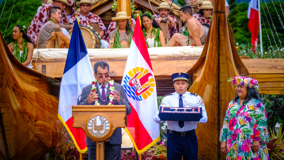 Before-presenting-the-Order-of-the-Tahiti-Nui-award-to-Noelline-Parker,-President-Fritch-speaks-of-her-many-accomplishments.-French-Polynesia,-June-2022