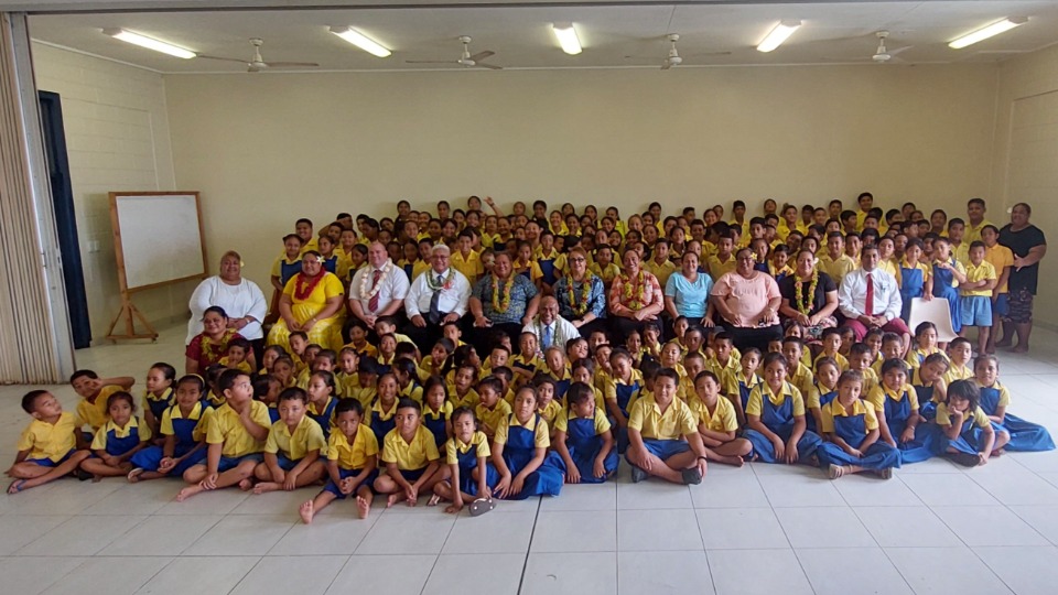 Elder and Sister Wakolo and other visitors with Sauniatu Primary School children, teachers and staff. June 2023.