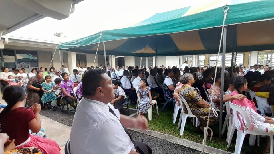 Attendees-sitting-in-overflow-seating-during-a-devotional-for-youth-and-young-adults-in-Savai'i,-Samoa-on-25-June-2023.