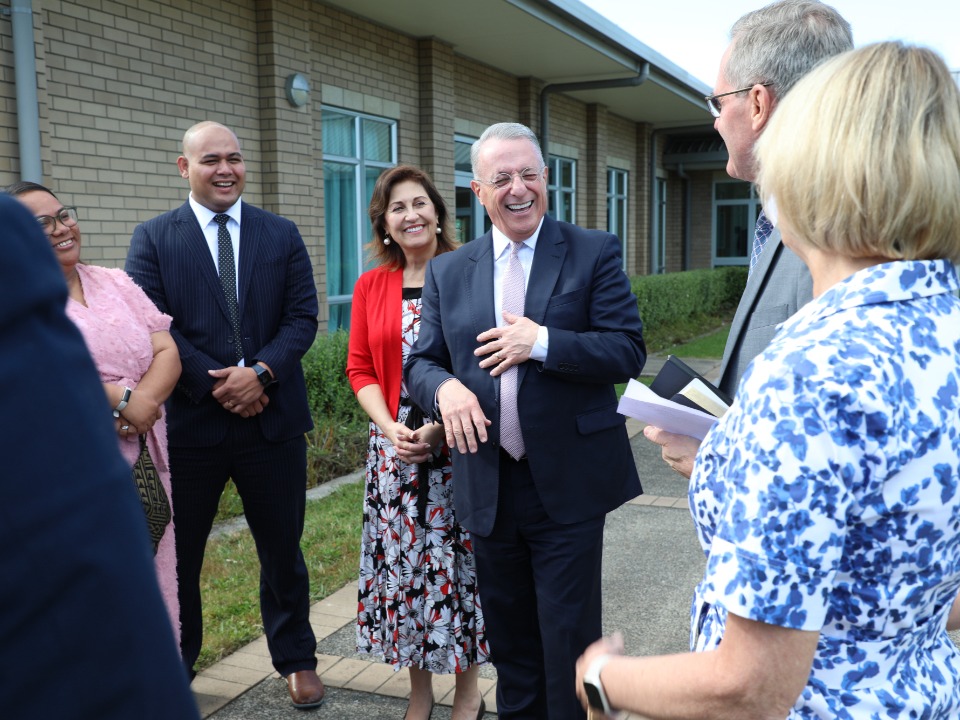 Elder Ulisses Soares greets Church leaders in Alfriston, Auckland on 12 March 2023.