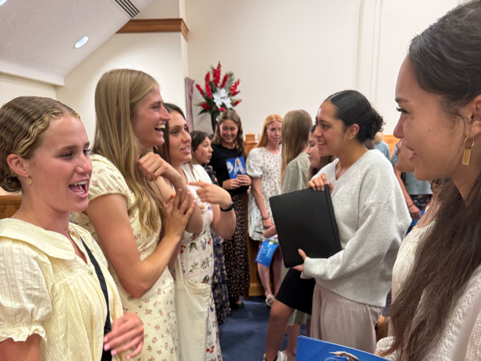 Players-from-the-BYU-women's-soccer-team-greet-youth-in-New-Zealand.-May-2025.